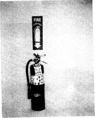 听力原文：（A) An extinguisher is being used to put out 